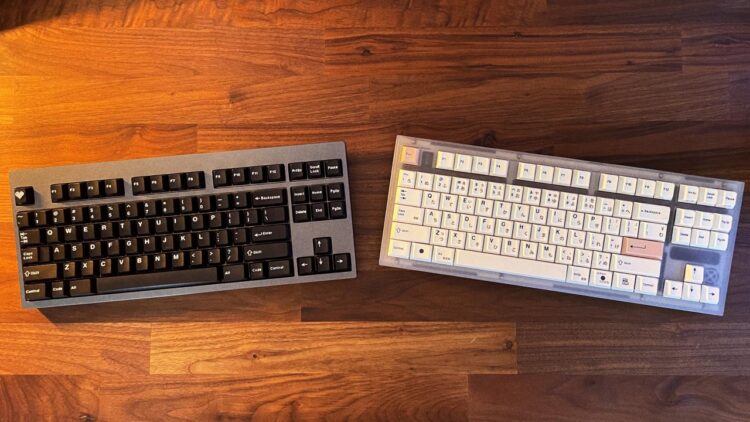 Two aesthetic mechanical keyboards with different keycap layouts placed on a wooden desk for visual customization