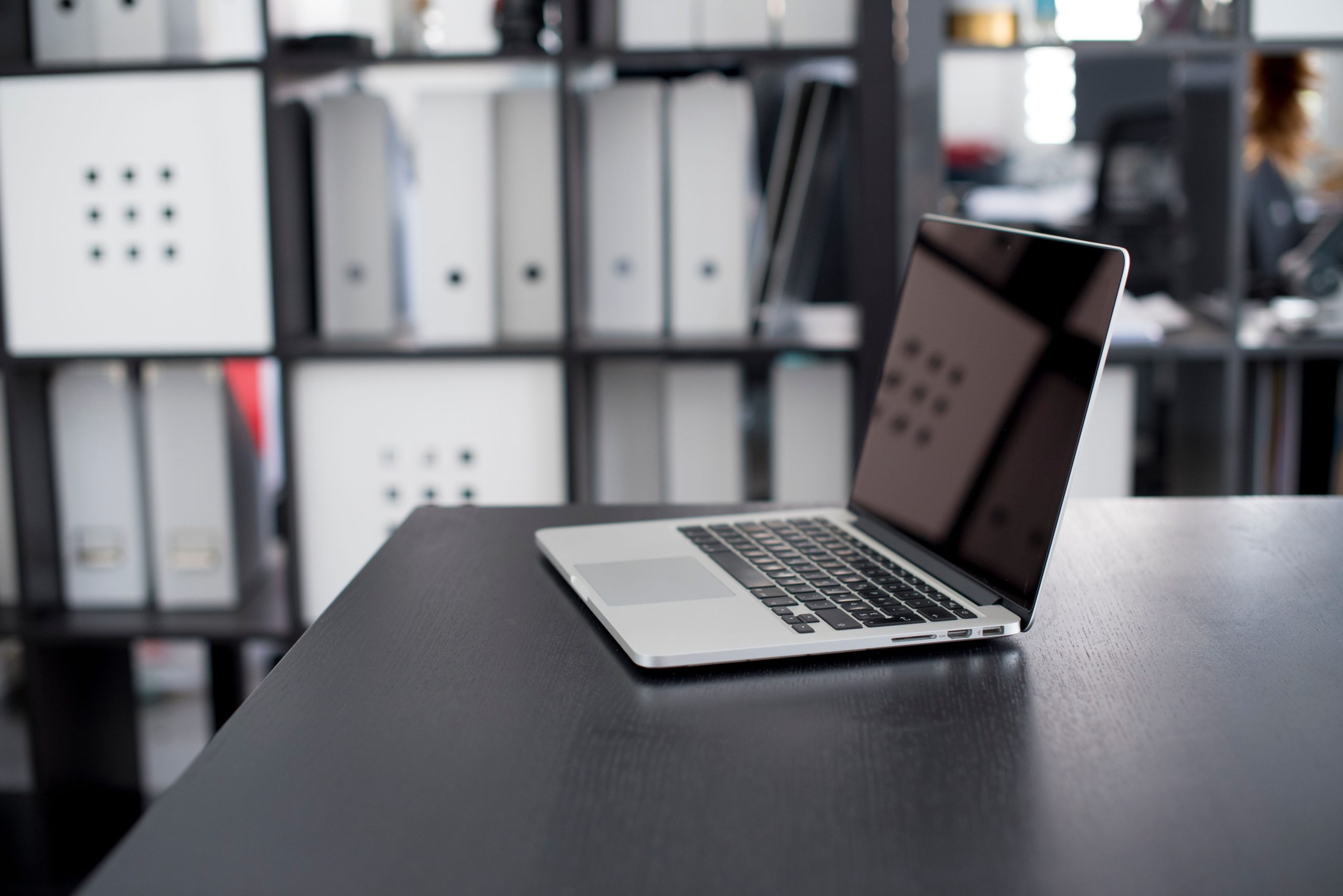 MacBook Pro on a desk, illustrating a computer that may slow down with age and use.